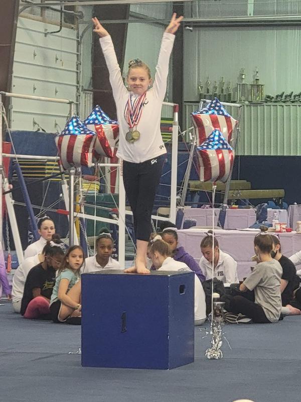Adelynn Rogers finished first on vault, beam and floor, second on bars, and earned the all-around title for her age group.